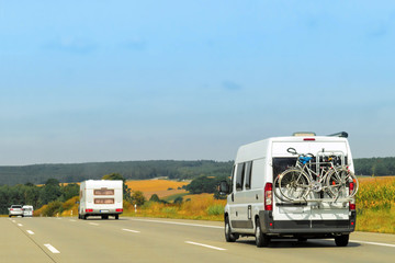 Fototapeta na wymiar Caravans on road in Switzerland