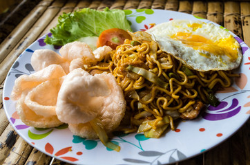 Typical Indonesian dish mie goreng close up full plate.