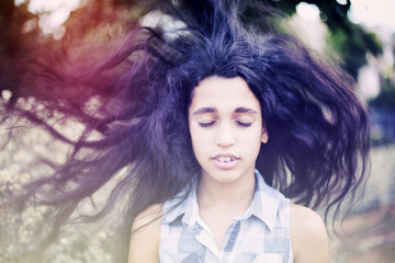 Portrait of a beautiful African little girl in park