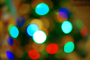 Multicolored defocused bokeh blurry lights. Christmas lights. Festive background