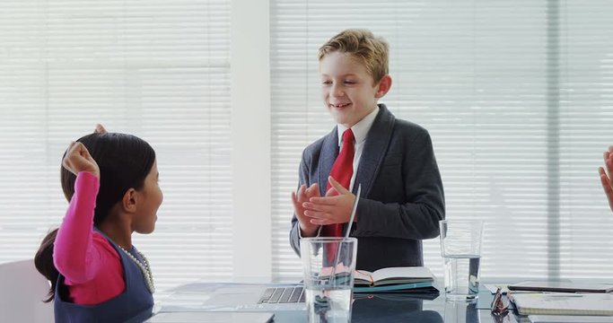 Kds as business executives having a meeting in the board room  