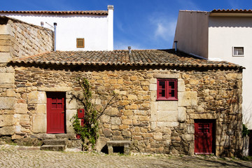 Fototapeta na wymiar Idanha a Velha, Portugal - April 9, 2017: Old traditional houses in the historic village of Idanha a Velha in Portugal; Concept for travel in Portugal
