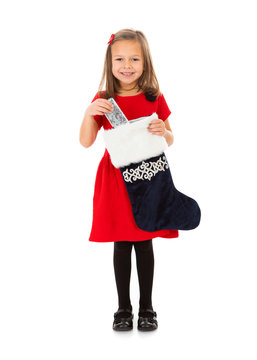 Christmas: Little Girl Takes Present From Stocking