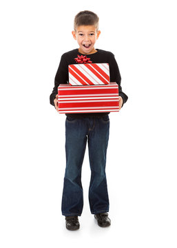 Christmas: Excited Young Boy Holds Stack Of Christmas Presents