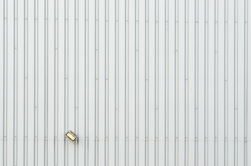 Warehouse exterior with single lamp, background