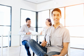 Young man in casual in office