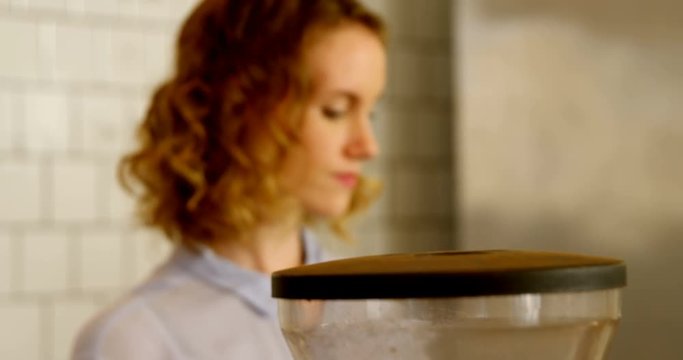 Female barista preparing coffee 