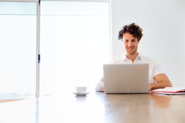 Man working on laptop at home