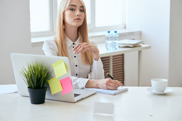 Business woman working at computer in office