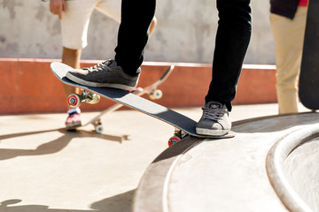 Fototapeta premium Teenage boy skateboarding outdoors