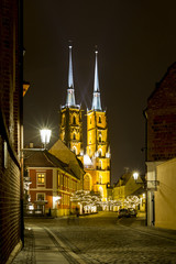 Fototapeta na wymiar Night photo of illuminated St. John the Baptist Cathedral in Wroclaw, Poland
