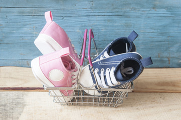Baby shoes and shopping basket