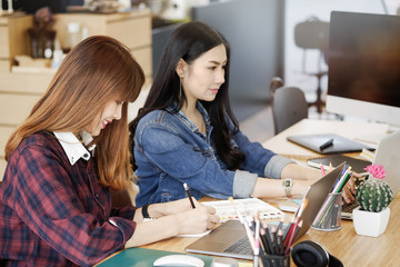 Teamwork,brainstorming concept. Creative designer at the workshop. Young creative design team working with new startup project in modern office.