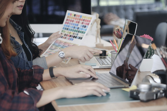 Teamwork,brainstorming concept. Creative designer at the workshop. Young creative design team working with new startup project in modern office.