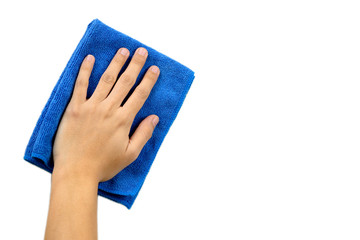 Hand and blue rag cleaning wall