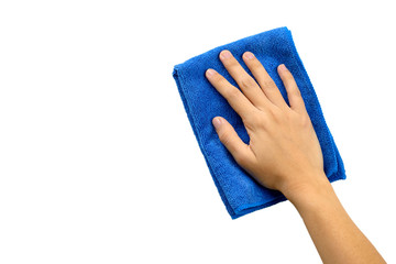 Hand and blue rag cleaning wall