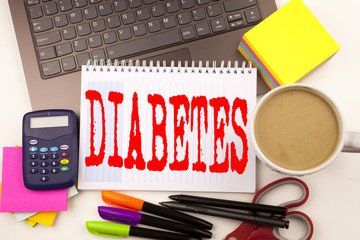 Word writing Diabetes in the office with laptop, marker, pen, stationery, coffee. Business concept for Disease Medical Insulin Workshop white background with copy space