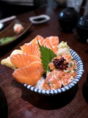Salmon Sashimi in bowl on wood table
