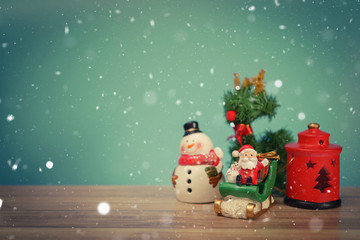 Christmas holiday background with Santa and decorations. Christmas landscape with gifts and snow. Merry christmas and happy new year greeting card with copy space.