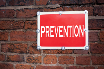Obraz premium Hand writing text caption inspiration showing Prevention concept meaning Business Medical health illness disease written on old announcement road sign with background and copy space