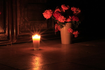 Candel offering with flowers in front of Mexican Church