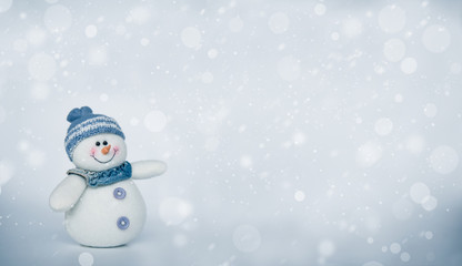 Cute snowman on cold grey background with snow fall, design for happy holiday celebration