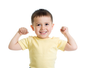 Portrait of cute kid showing the muscles of his arms, isolated on white
