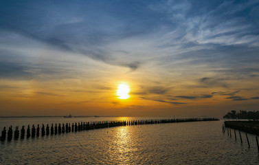 Fototapeta na wymiar Sunrise at the sea with light on bright blue sky background