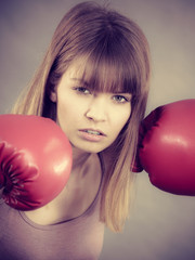 Woman wearing boxing gloves