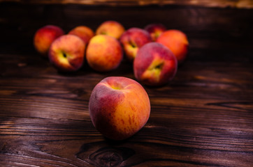 Fresh ripe peaches on wooden table