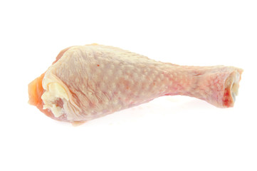 Raw chicken leg on a white background