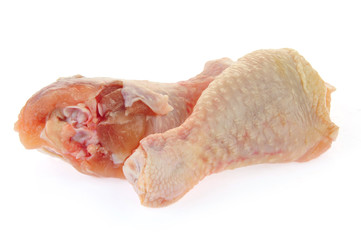 Raw chicken leg on a white background
