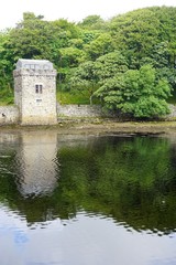 Medieval stone tower on the shore