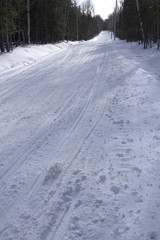 Fototapeta na wymiar Snowmobile trail in winter on Bald Mountain in Rangeley, Maine.