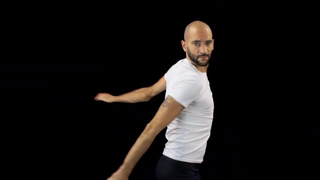 a skillful male dancer dancing in a contemporary style