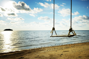 Swing hang on a tree beside the beach in Thailand