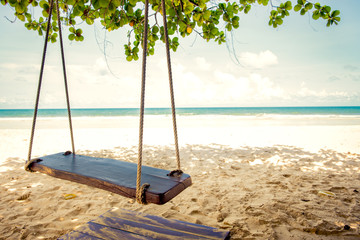 Swing hang on a tree beside the beach in Thailand