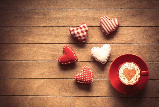 Cup of coffee and heart shape toys
