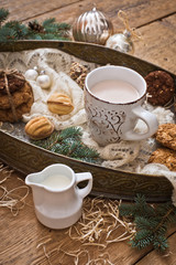 Obraz na płótnie Canvas Mug with drink and cookies with Christmas decoration