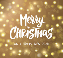 Merry Christmas and Happy New Year hand drawn text. Holiday greetings quote. Golden glowing sparkling lights background, bokeh effect.