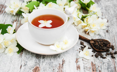 Cup of tea with jasmine flowers