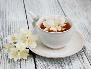 Cup of tea with jasmine flowers