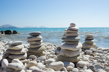 Pyramid of pebbles on a sea beach.