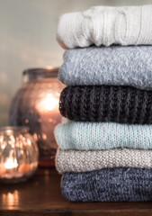 Stock of warm sweaters in beige and blue shades