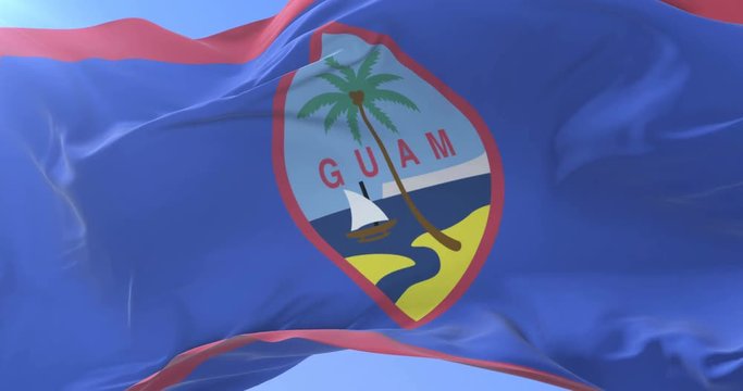 Guamanian flag waving at wind in slow in blue sky, loop