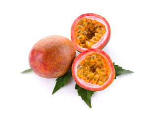 whole and half cut passion fruits on white background