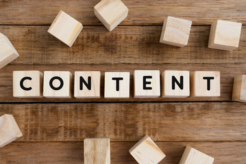 Content word on wooden block, retro style.