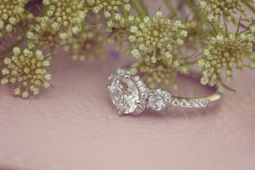 Diamon wedding engagement ring on natural romantic background