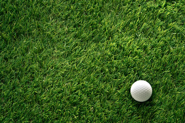 Golf ball on green grass in golf course