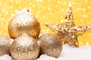 Christmas composition of Christmas tree toys on a gold background